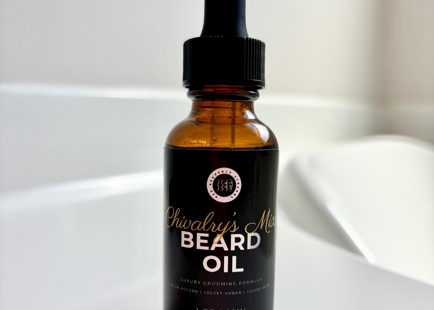 Bottle of beard oil with dropper on a white surface