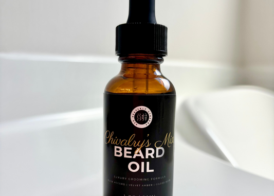 Bottle of beard oil with dropper on a white surface